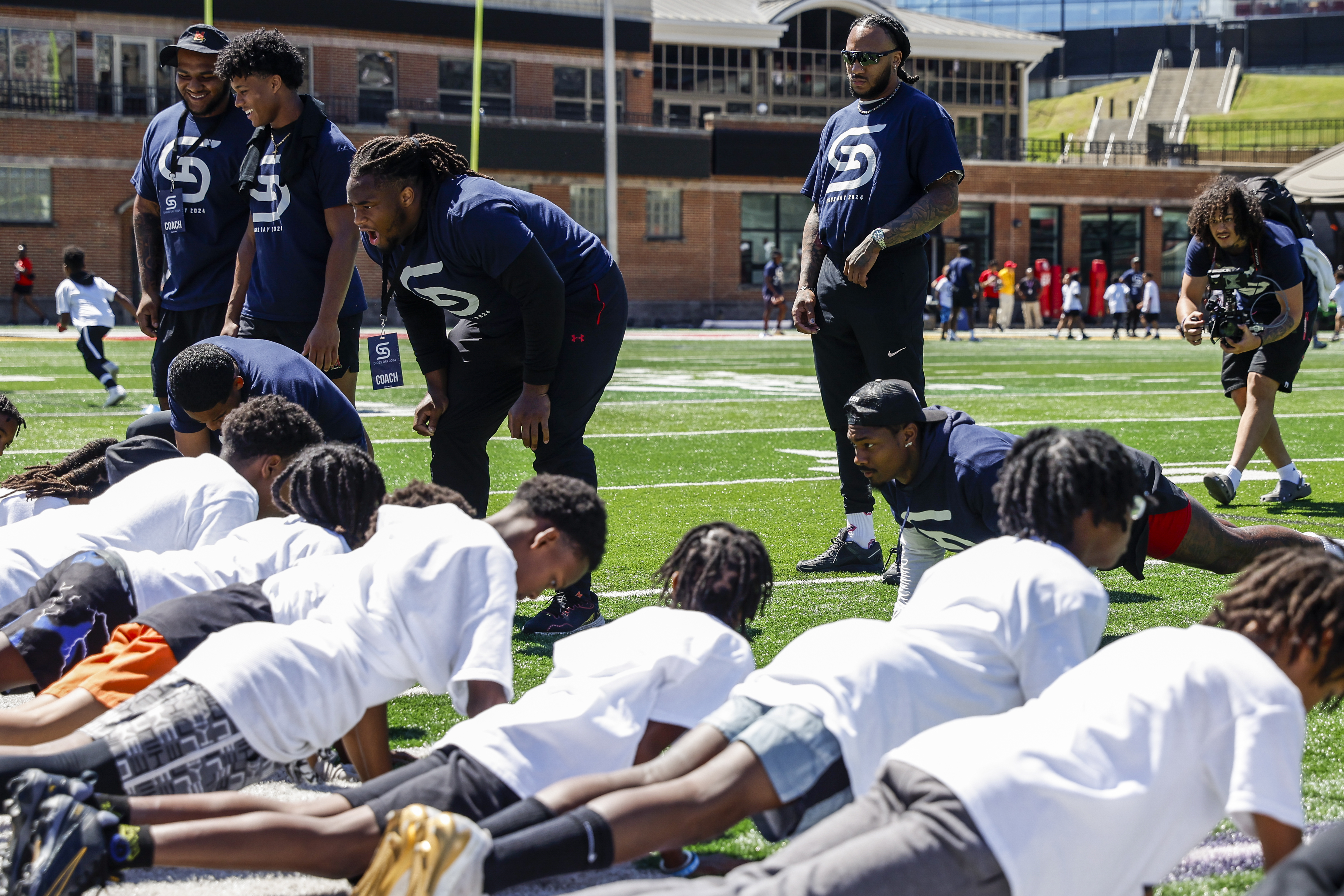 Defensive line Jordan Phillips (8) and Stefon Diggs
3rd Annual Diggs Day Youth Camp at SECU Stadium in College Park, MD on Saturday, Jun. 8, 2024. 
Chris Lyons/Maryland Athletics